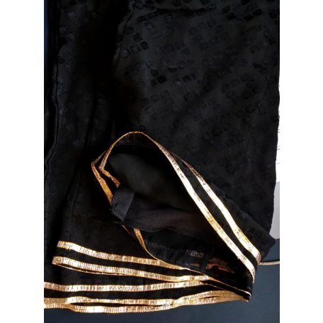 Dimond pattern black palazzo pant with gold stripes at the end